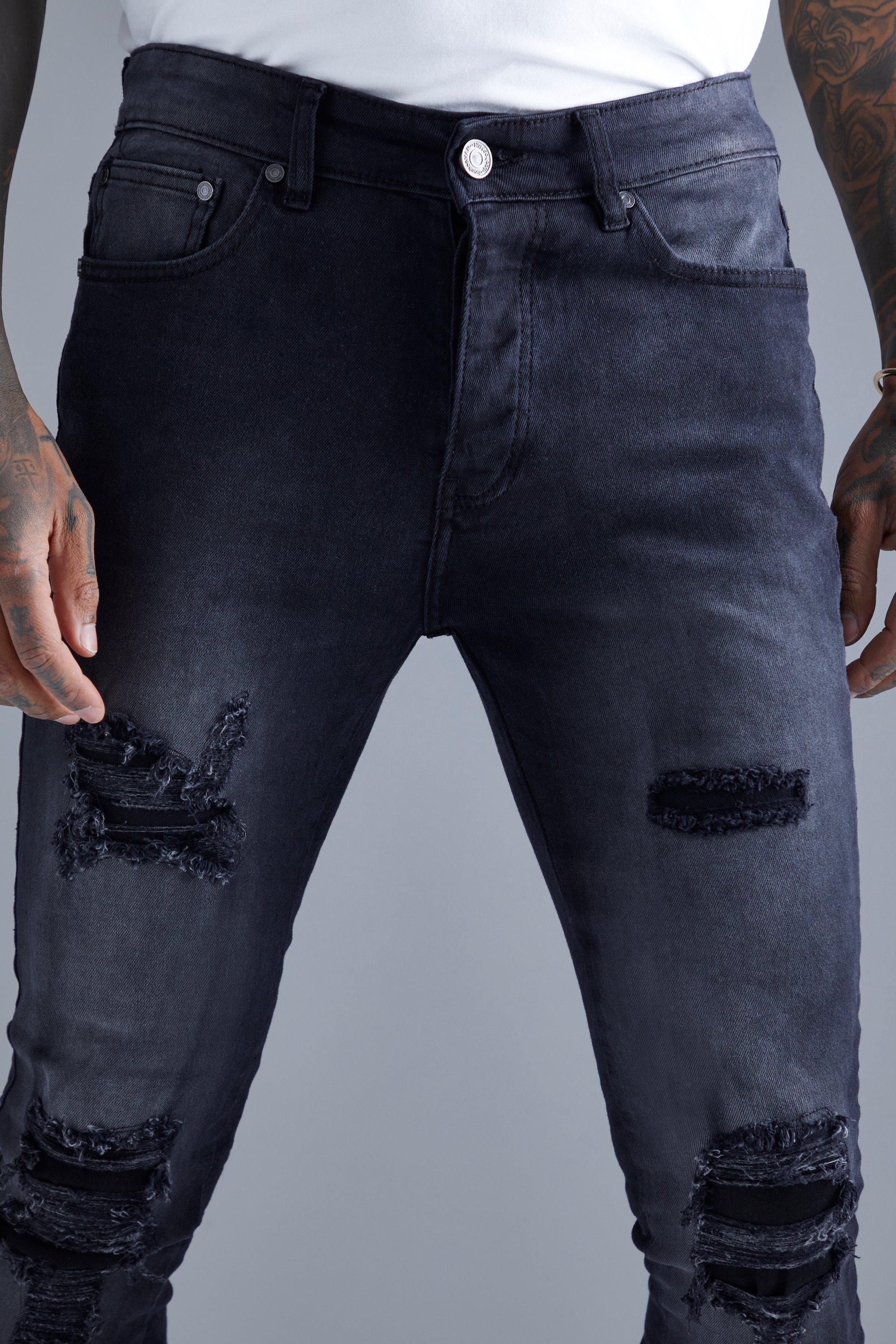 Black ripped store and repaired jeans